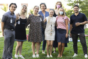 Eight staff members pose for photo