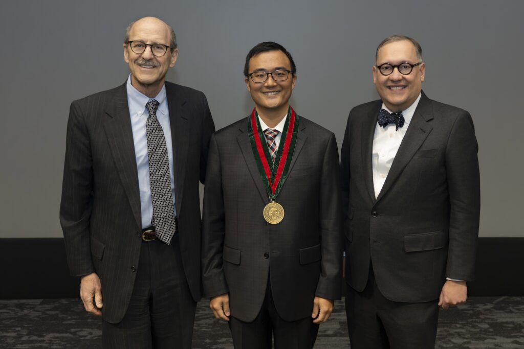a photo of three leaders at an award ceremony