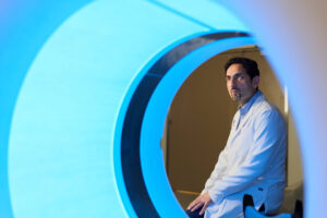 Man framed by CT scanner