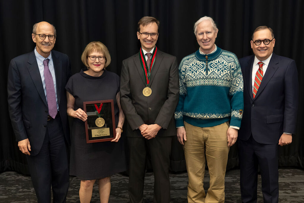 Group photo for the installation of Andrew Groves (middle) as the inaugural Stuart A. Kornfeld Distinguished Professor