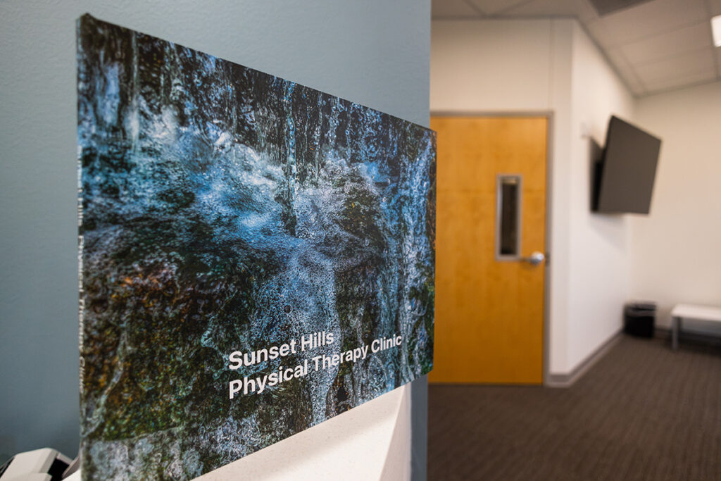 Image hanging on wall that reads "Sunset Hills Physical Therapy Clinic"