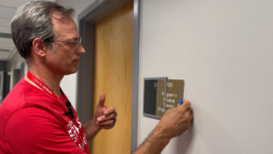 Bob Henkel, the inaugural Program Manager for Signage in Enterprise Physical Operations at WashU Medicine