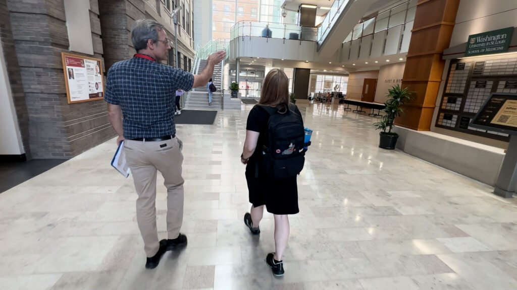 Bob Henkel helps Shawn Ballard navigate the WashU Medicine campus.